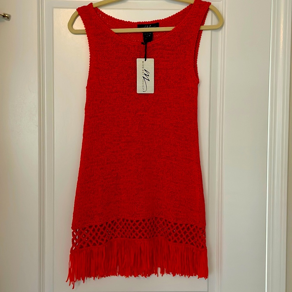 A beautiful orange tank sweater. Never been worn still has tags on it